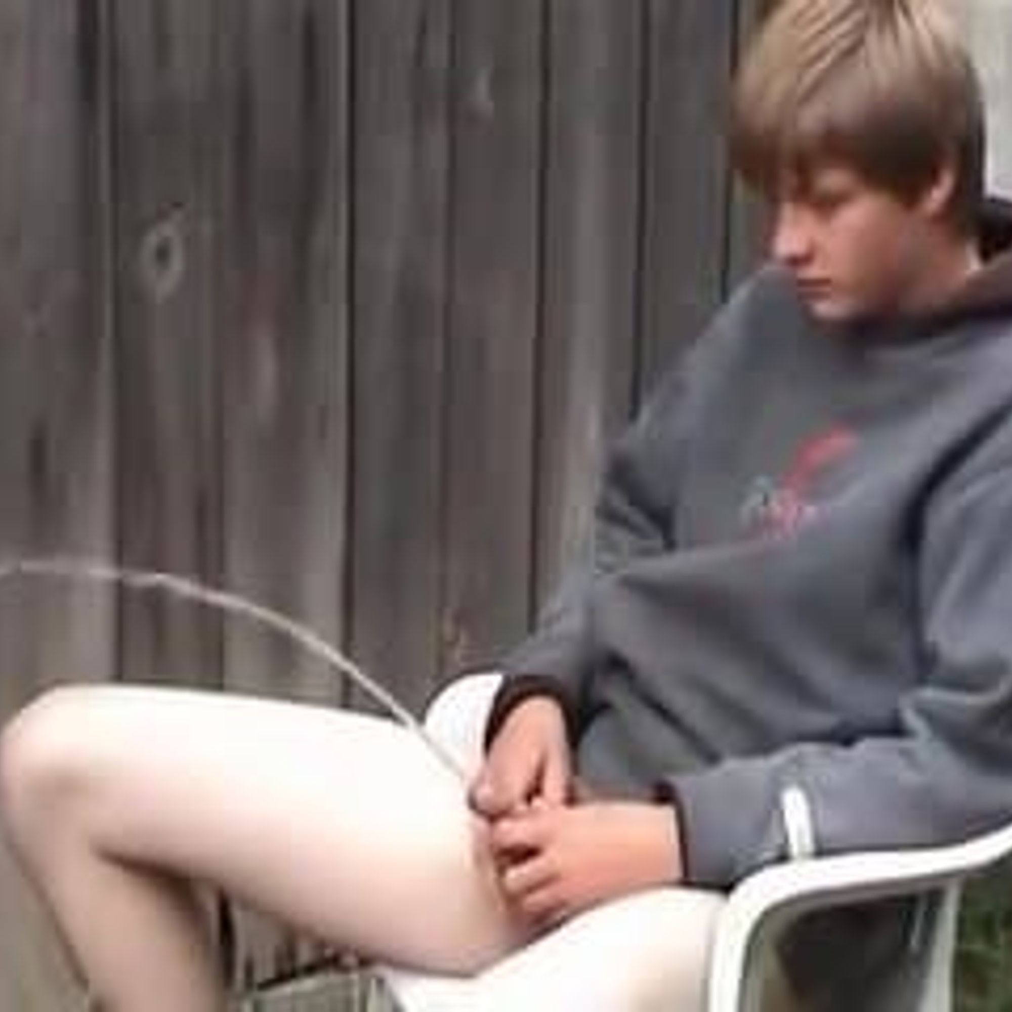 Naked teenage boy peeing