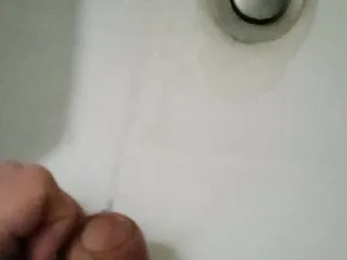 College: Student with a big fat cock pissing in the sink in a public toilet
