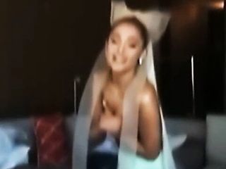 Ariana Grande topless holding her boobs behind the scenes