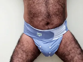 WEARING BLUE DIAPER LOOKING FOR A MOM WITH MILK.