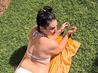 Pissing on my girlfriend lying in a bikini tanning