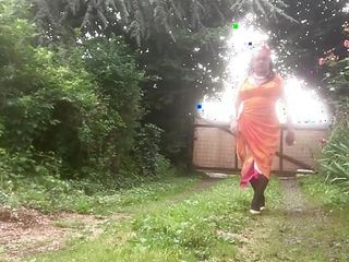 In orange dress outdoors