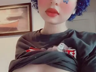 Depressed butterfly goth girl plays with her boobs 