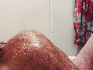 Taking an oil bath with a big cock on my face 
