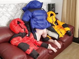 HumpingNorth Face Baltoro Down Jackets on Leather Couch Sofa.