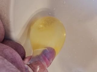 Peeing into a condom - try to let it burst