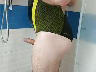 Boy in sexy Speedo one piece swimsuit get shower 