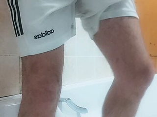 Pissing in my Amsterdam footie jersey and white Adidas shorts