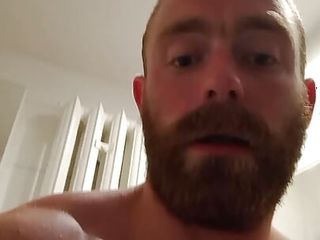 Muscular fitness bodybuilder is cleaning body taking shower and doing muscle worship