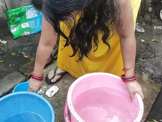 Indian bhabhi bathing outside with