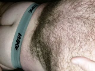 Hairy Pup wearing just jockstrap and socks swallows boys thick cock showing off his Pup tail, tight ass, and hairy back