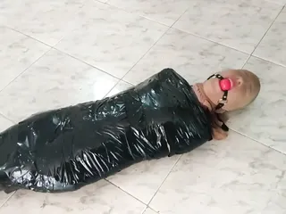 Tape Mummified Girl in Pantyhose Hooded And Ball Gagged