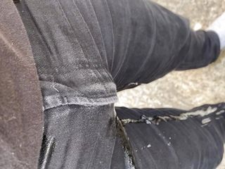 Pissing my black jeans outside 