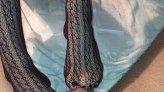 Fishnet stockings footjob