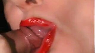 mature redhead wearing red lipstick and sucking cock