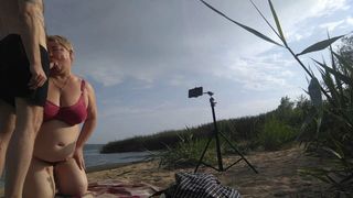 blowjob and cum in mouth on a public beach