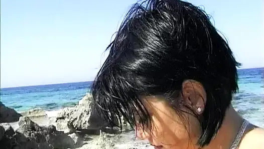 A hot German chick gets double penetrated on the beach
