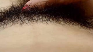 Mexican slut runs her fingers through her hairy pussy