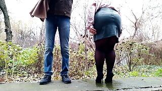 Son-in-law strokes mother-in-law's fat ass while she pees outside