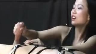 Asian woman torturing him post orgasm handjob