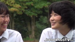 Cute Japanse schoolgirl with pigtails pisses in the wind