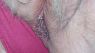 Mature pussy close-up showing pink clit