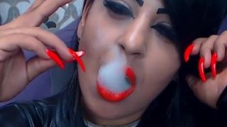 Smoking with red lips and long nails