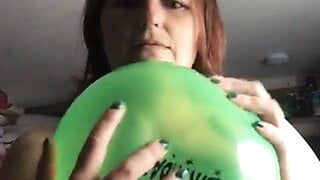 Playing with a balloon and bursting it against my boobs