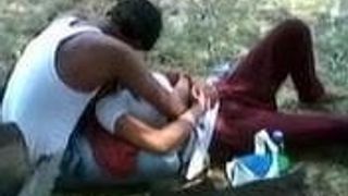 Indian Girl allow to play her lover with her Boobs in a Park