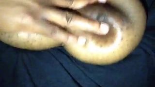 Horny Nigerian girl sucks her own nipple