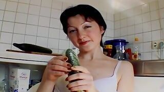 Small titted German chick sucking a cock and playing with a cucumber