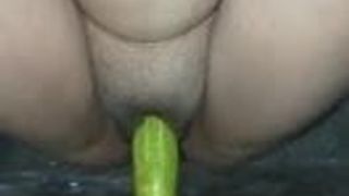 Desi girl trying cucumber into her right pussy