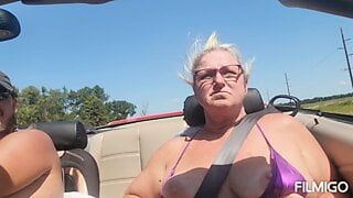 Tits out while riding in a convertible