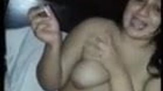 Nude Indian woman smoking