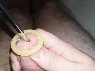 Rolling condom into urethra, urethral sounding, Close Up