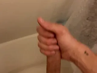 Young Slim Twink Strokes Squirts Shower...
