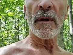 Daddy take a walk in the Wood, stroking his dick, and  have his balls bouncing in the outdoors