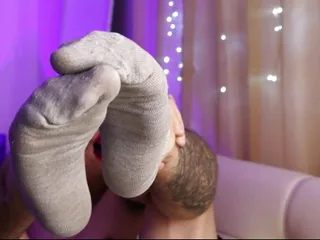 Dude shows his sweaty, smelly socks...