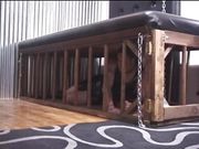 Hot dominatrix duo paddles their male captive's ass over table 