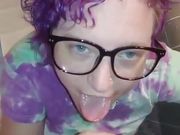 Liza works a cumshot out of Andy's cock and all over her glasses