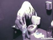 Hot Blonde fingering her pussy public toilet