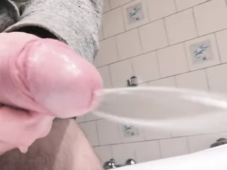 Close-up side view soft dick peeing a hard steady jet of pee