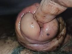 Jerking off the cock head and shaft and finger fucking in the urethra that  has as split in half 
