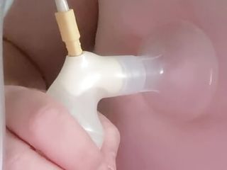 Amanda the fat sissy milking its tit udders with a breast pump while in a mask and chastity AmandaFatSissy.