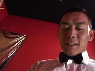 Asian man waits in room for...