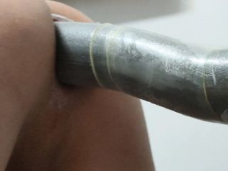 Close-up anal toying with dildo