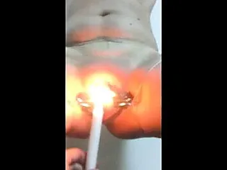 Women playing with candle inside pussy...