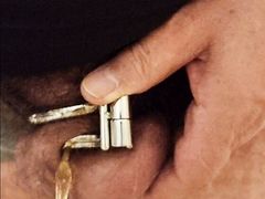 Piss with chastity cage