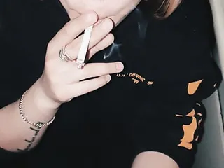  video: Slutty Blonde Teen Sucks and Smokes a Cigarette