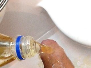 Pissing in bottle and pouring it over my cock